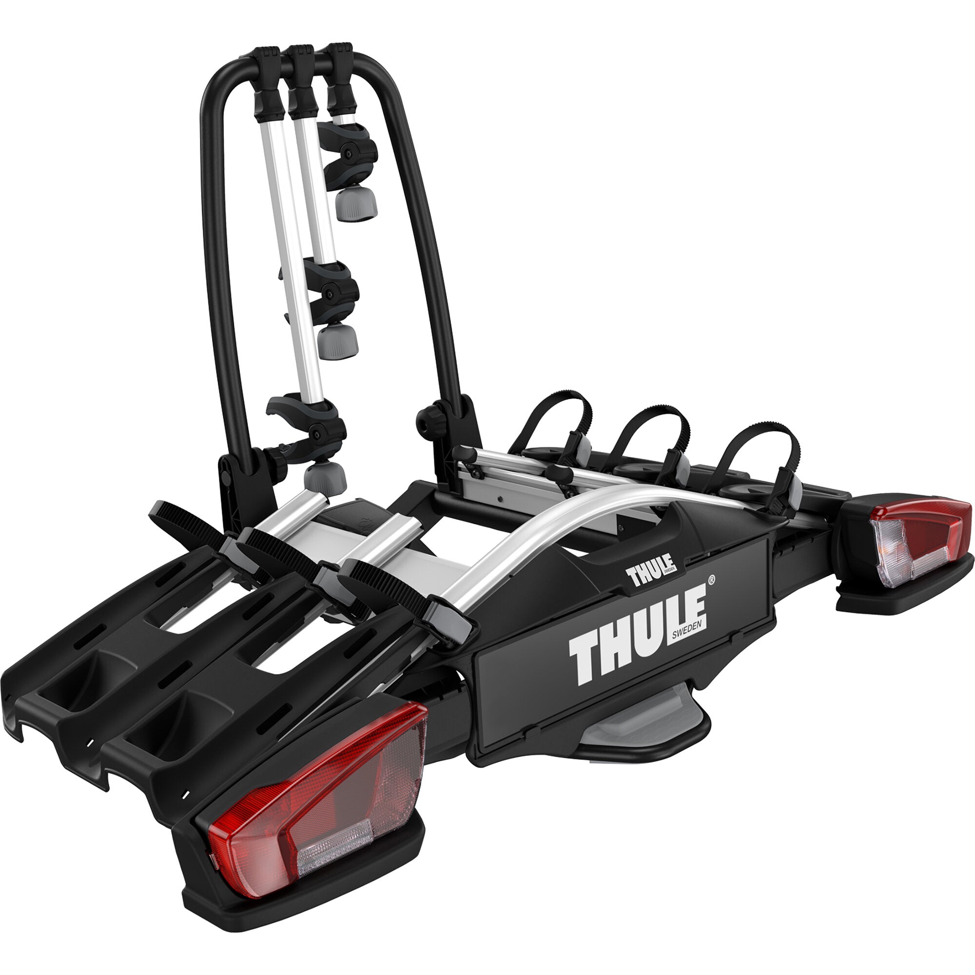 Seitliche Sicht auf einen schwarzen Thule VeloCompact 3 Fahrradträger, mit silbernen Haltearmen, grauen Klemmen und integrierten Rückleuchten am Heck