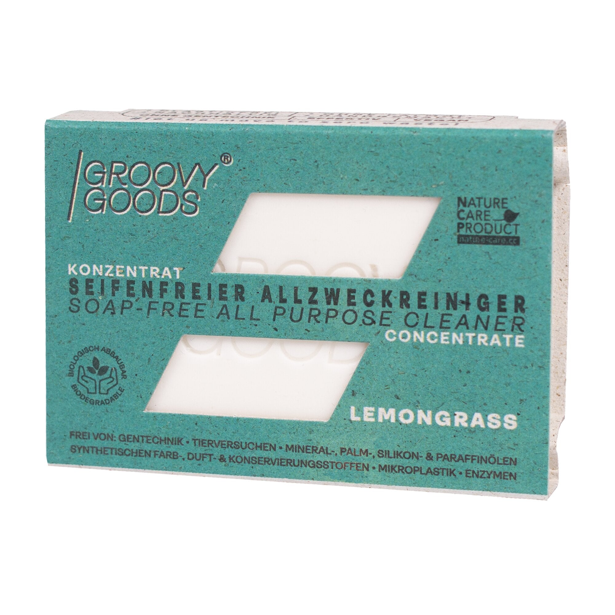 Tealfarbene Verpackung eines seifenfreien Allzweckreinigers mit Fensteröffnung, Groovy Goods Logo links, Lemongrass unten rechts
