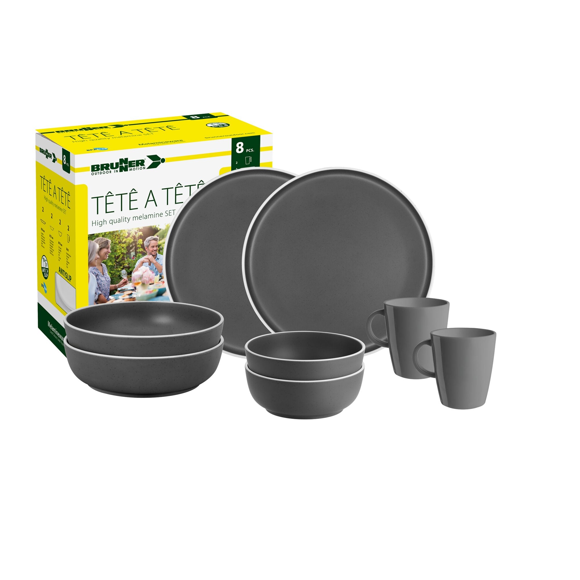 8-teiliges Melamin-Geschirrset Tête-à-Tête Dolomit grau mit Tellern, Schalen, Tassen und Bechern neben gelb-weißer Brunner-Verpackung