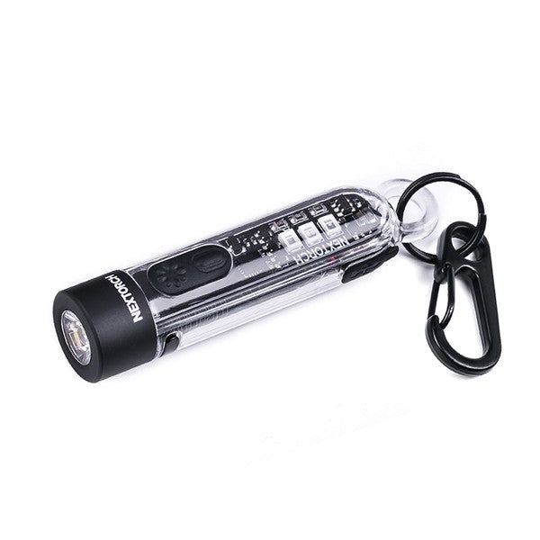 Transparente NEXTORCH K40 Mini-Taschenlampe mit schwarzem Kopf, silbernem Clip und Schlüsselring, USB-C Ladeanschluss.