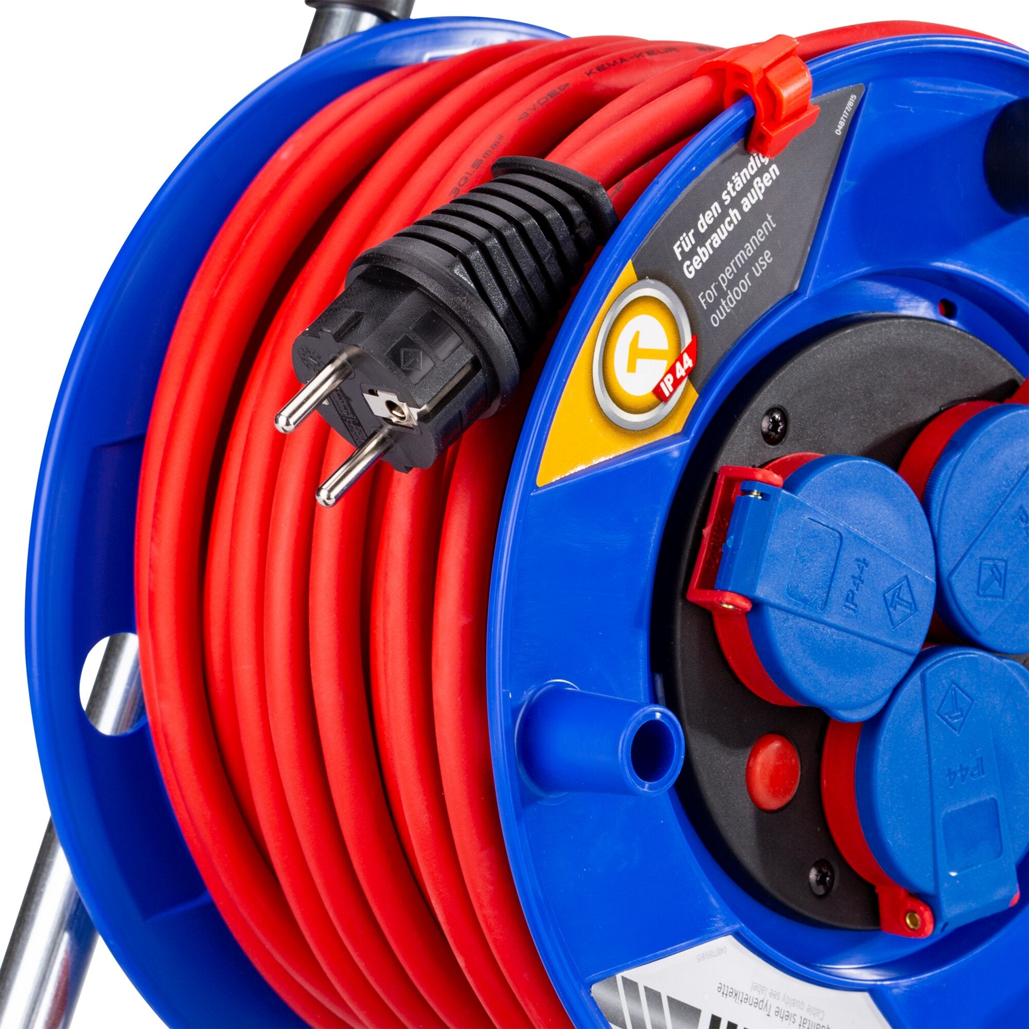 Kabeltrommel Schuko 240 in Blau mit roter Verlängerungskabel, aufgewickelt, sichtbarer Schuko-Stecker und Griffmulde am Gehäuse