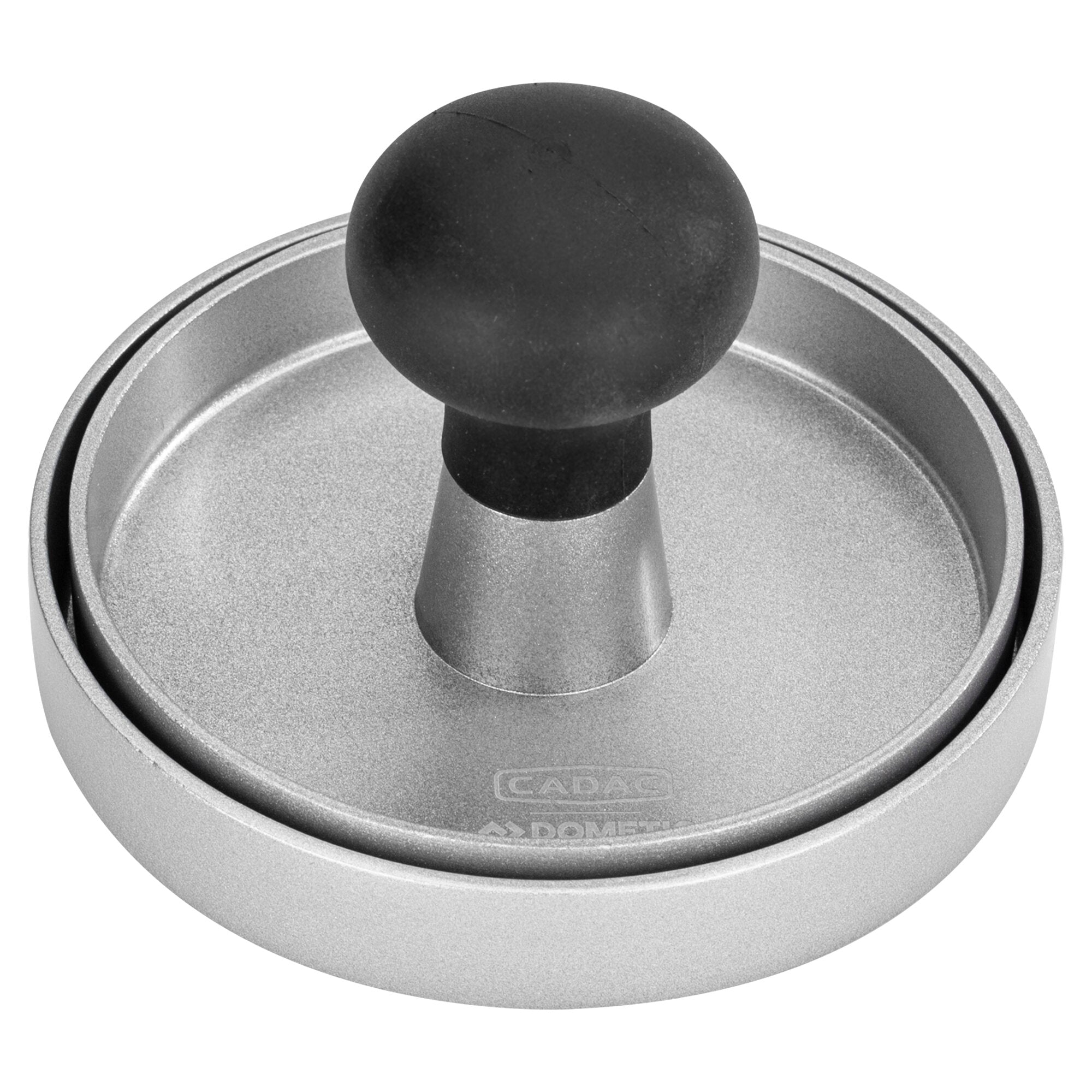 Nahaufnahme einer runden Hamburgerpresse aus Metall mit silbernem Gehäuse, sichtbarer Oberflächenstruktur und schwarzem Knopf in der Mitte