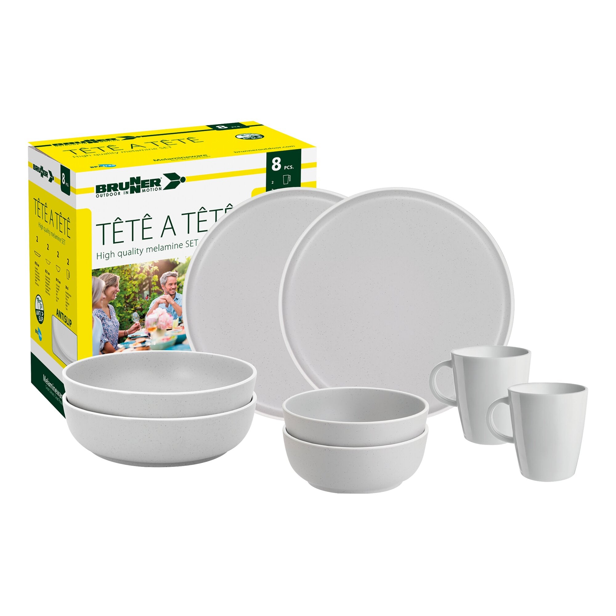 Gelbes Verpackungsdisplay mit dem Text Tête-à-Tête Dolomit, daneben weiße, gesprenkelte Melamin-Geschirrteile wie Teller, Schalen und Becher