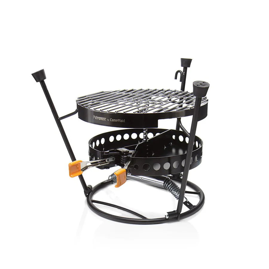 Dreiteiliges Petromax Pro-ft Set mit rundem Grillrost, höhenverstellbarem Kohlekorb und schwarzem Stahlrahmen, ideal fürs.